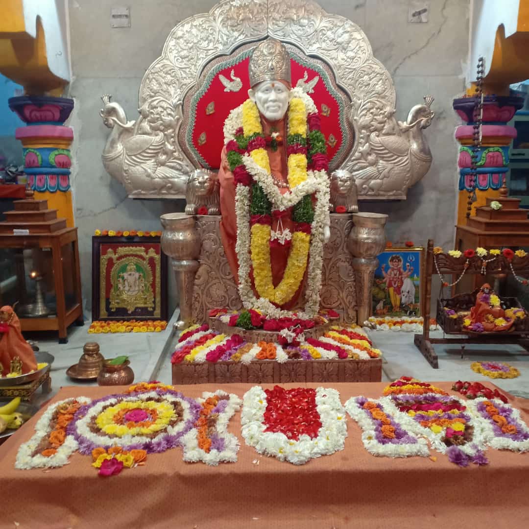 Sai Baba sanctum with flower rangoli